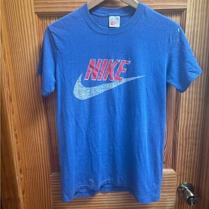 Vintage Nike Blue T‑Shirt with Red Logo and White Swoosh